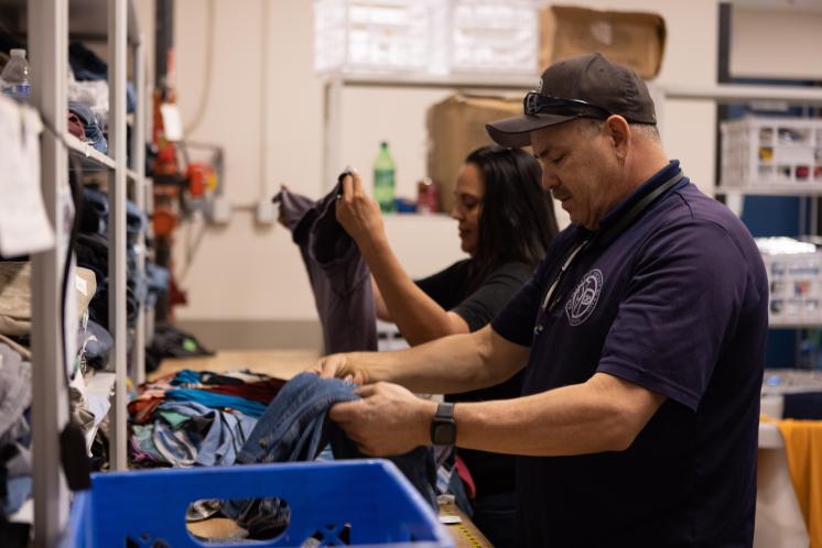 Staff sorting clothing in the Resource Center