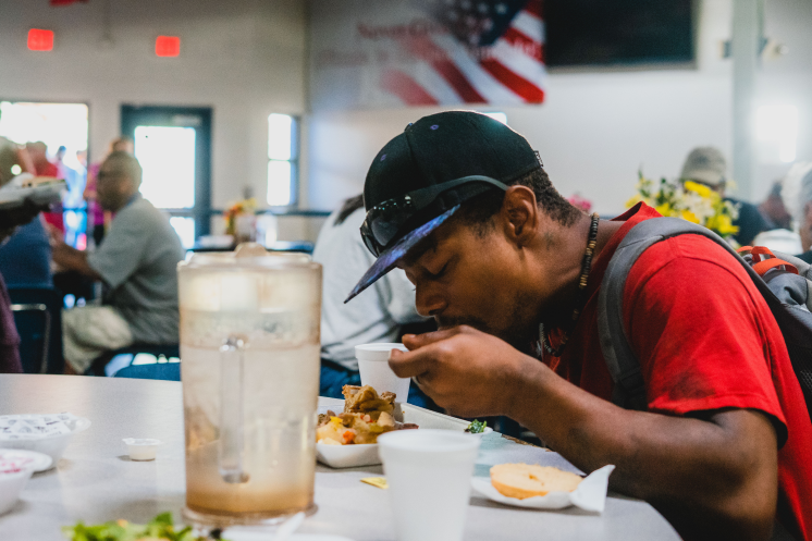 Man eating food at a St. Vincent de Paul dining room