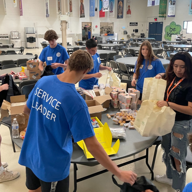 Vinnie's Service Corps Leaders packing sack lunches