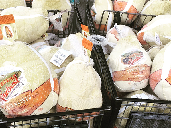 piles of turkeys in shopping carts