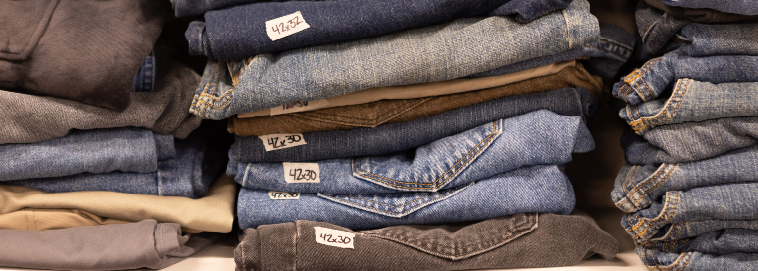 jeans stacked on a shelf