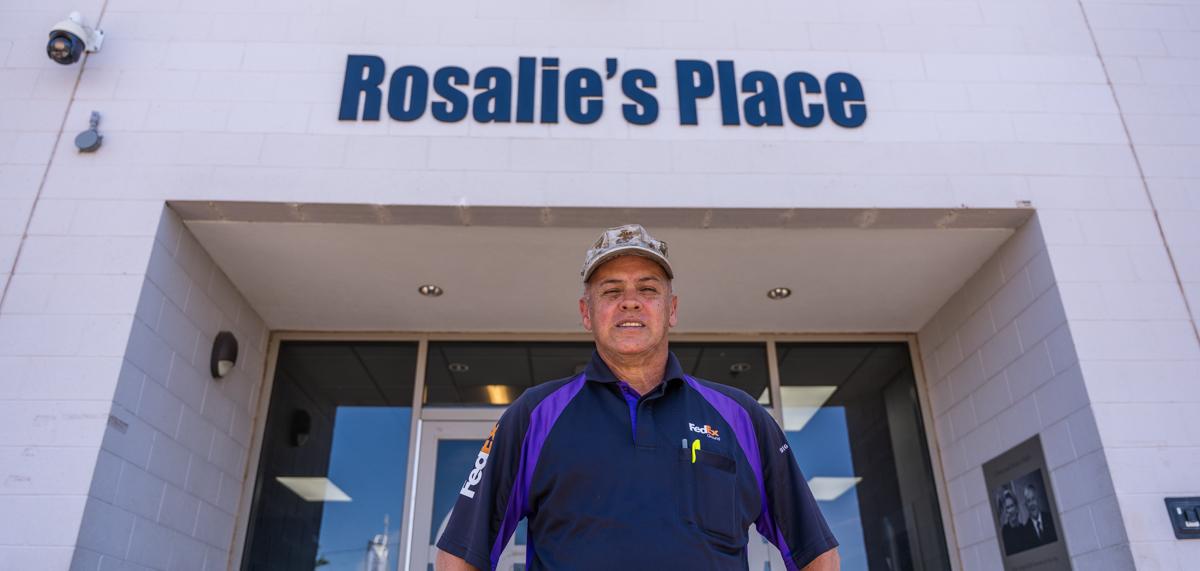 Roberto stands outside his former shelter, Rosalie's Place.