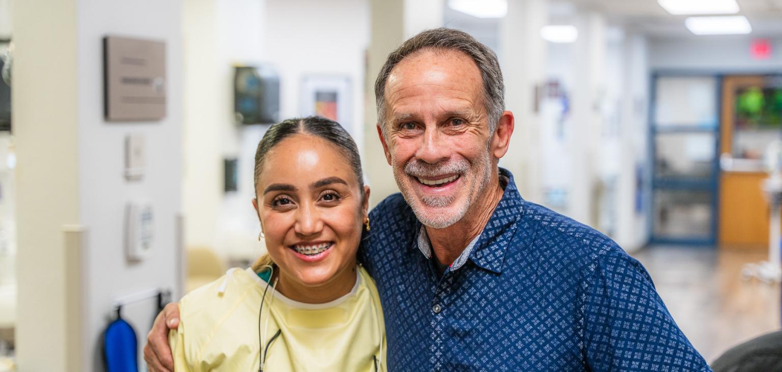 Anthony poses with his dentist, Dr. Leyva.