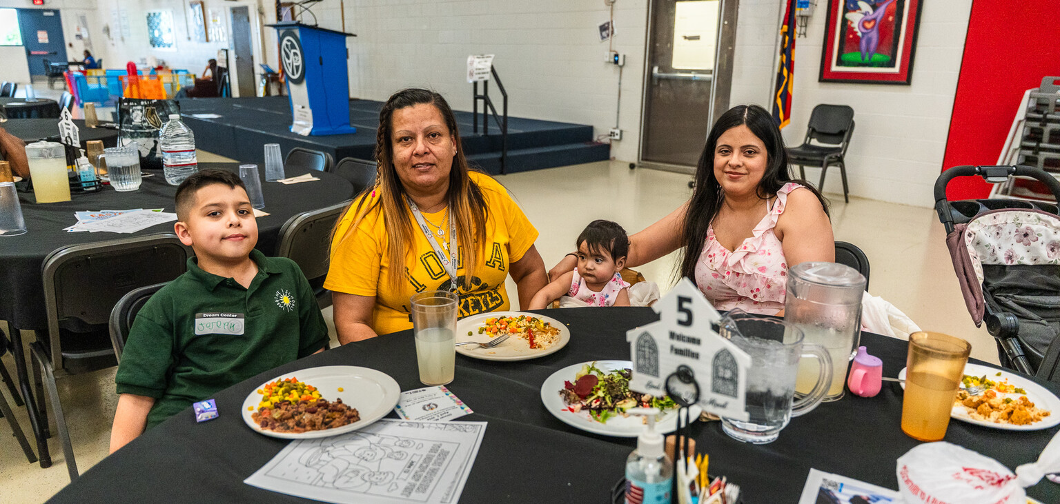 Adriana Moody sits with her children and granddaughter at FEM.
