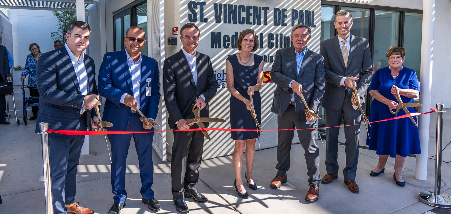SVdP CEO Shannon Clancy cuts the ribbon with community partners and Phoenix Diocesan Council President Shirley Smalley cropped for header