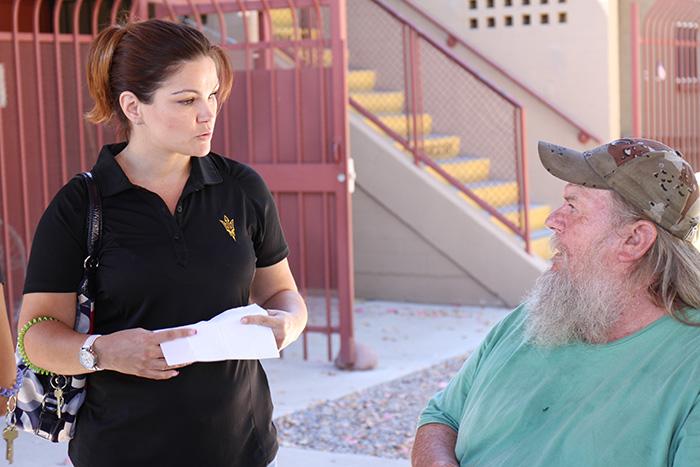 ASU intern Kim Speed talks with a resident at Ozanam Manor.