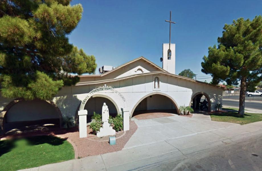 View of a white building with a cross