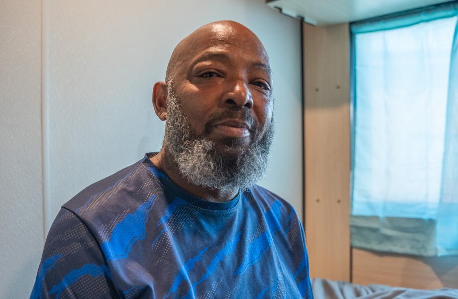 Dennis Robinson sits in his room in the X-WING at SVdP's Washington Street Shelter.