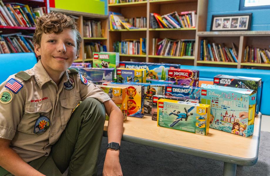 Wilder poses with some of the Lego sets he brought in.