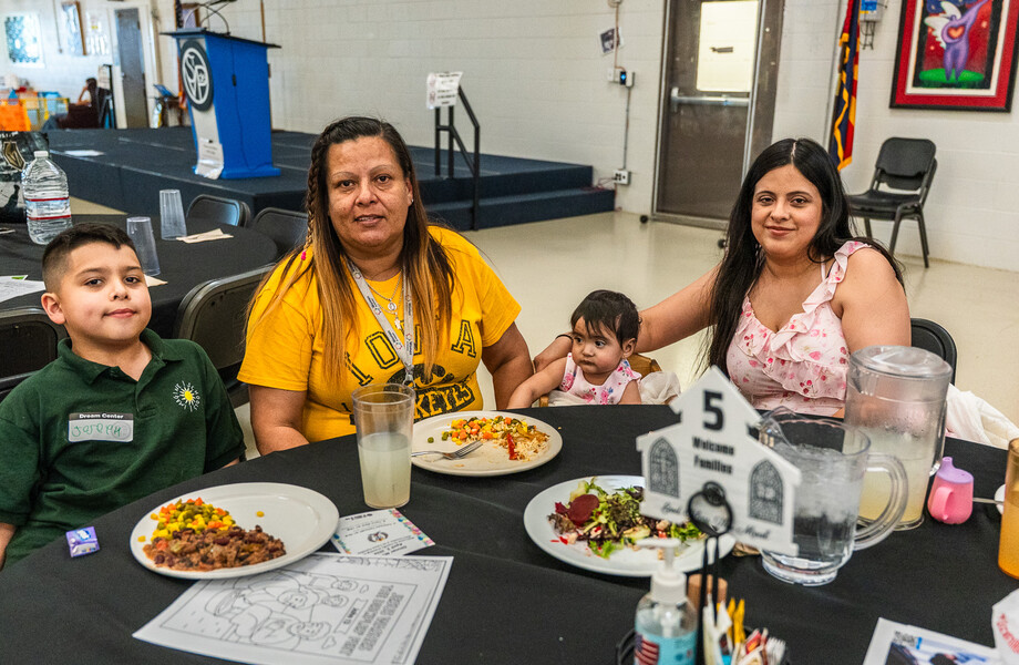 Adriana Moody sits with her children and granddaughter at FEM.