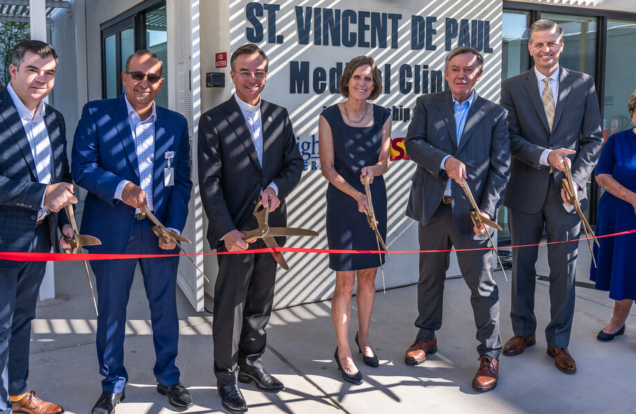 SVdP CEO Shannon Clancy cuts the ribbon with community partners and Phoenix Diocesan Council President Shirley Smalley cropped for header