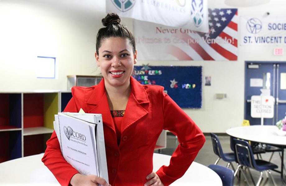 Jasmine poses for a photo in SVdP's downtown Phoenix dining rom.