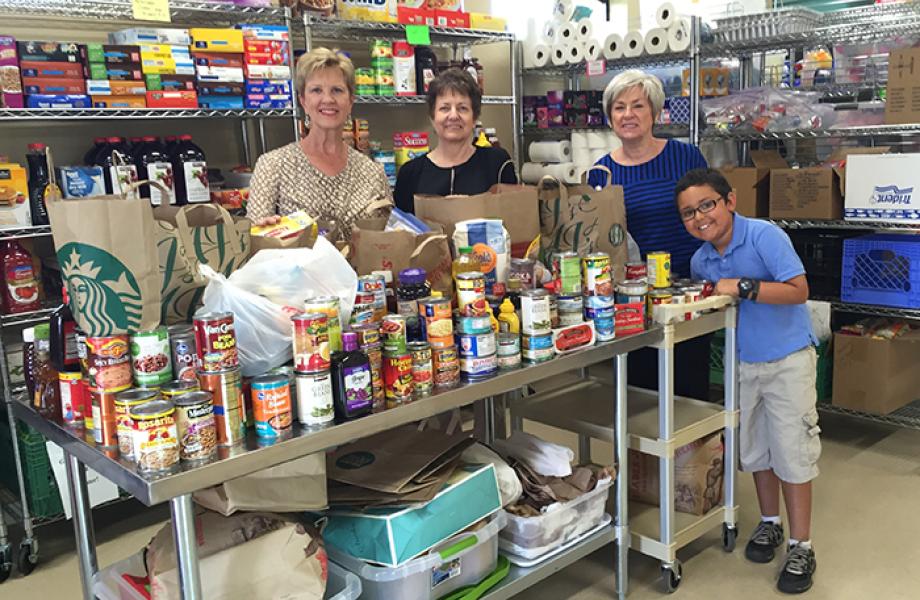 Kegan brings drops off donated food to nearby St. Vincent de Paul food pantry.