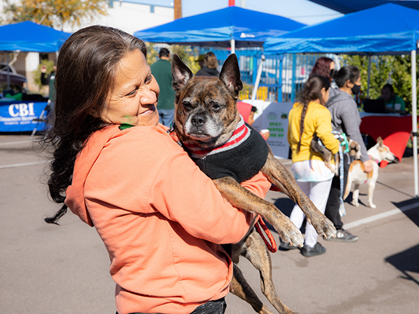 Woman holding a small dog