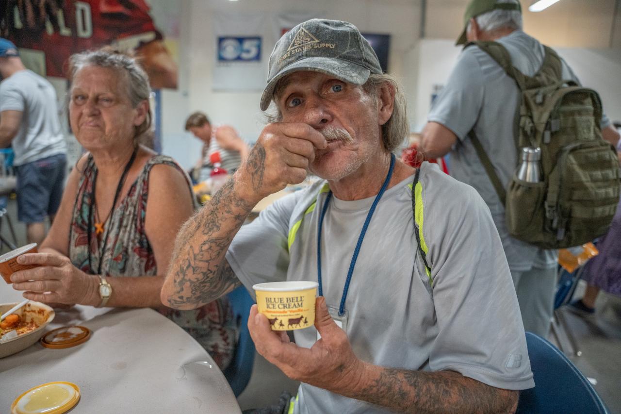 A guest at SVdP's Phoenix Dining Room enjoys a donated serving of ice cream at lunch.