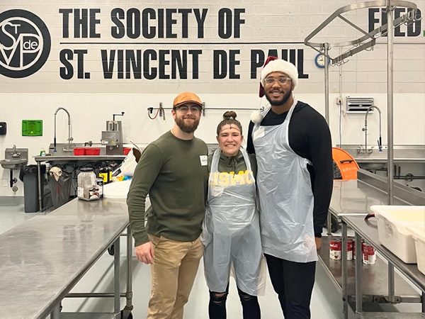 xavier walker with other volunteers in svdp kitchen