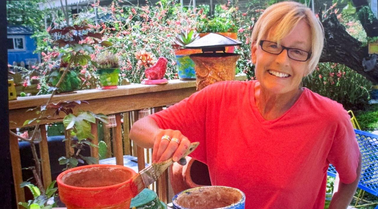 Patricio's wife, Bernessa, paints a pot in an old photo. (Courtesy of Patricio Espinoza)