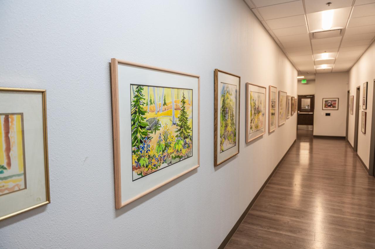 One of the many hallways decorated with paintings.