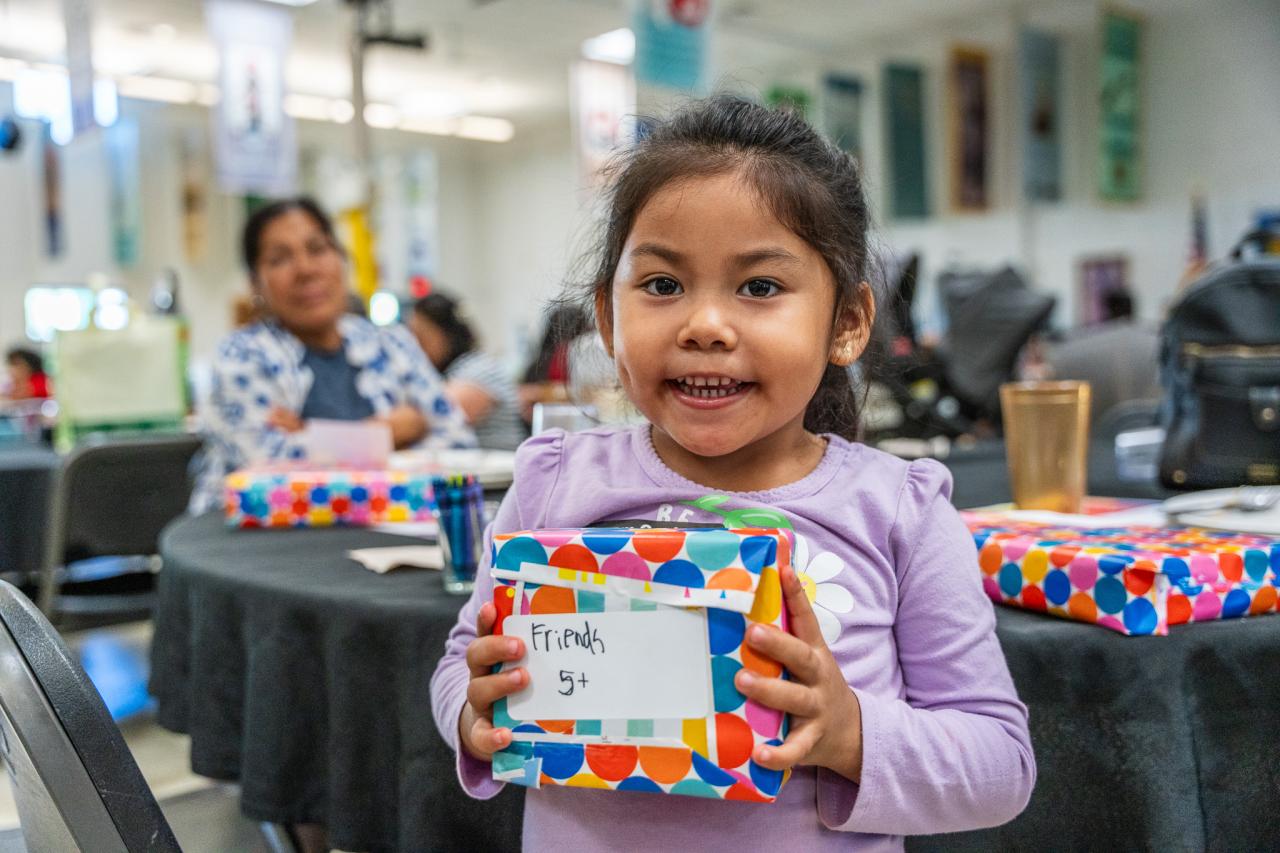 A girl poses with her Lego set.