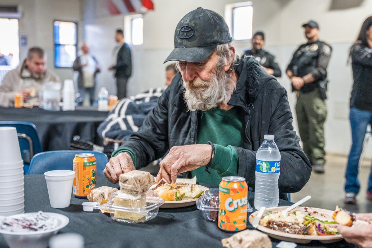 A man eats in SVdP's Phoenix Dining Room.