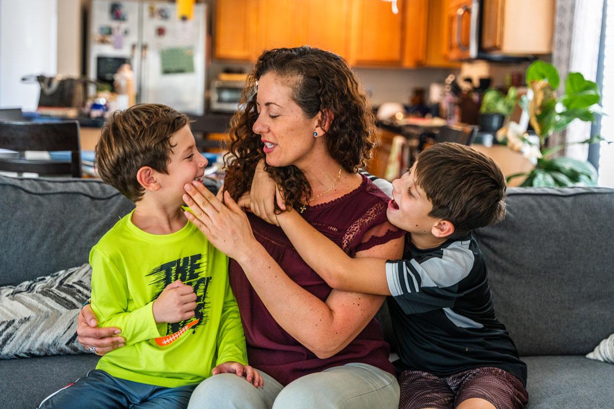 Daniela and her two boys (from left) Nino and Rocco, ready themselves for a family portrait.