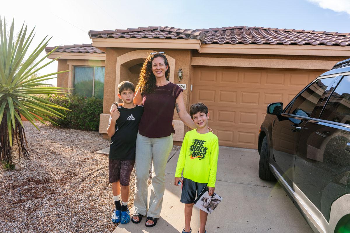 Daniela and her boys pose outside their rental home in Cave Creek shortly before dinner with their grandmother.