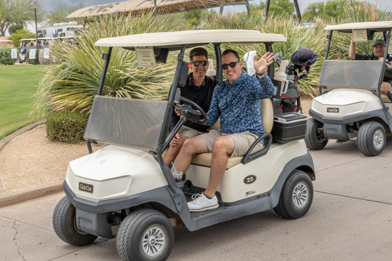 Ryan Corry travels via golf court as he helps run the 6th Annual Spring Golf Clasic Tournament with Sunflower Bank.
