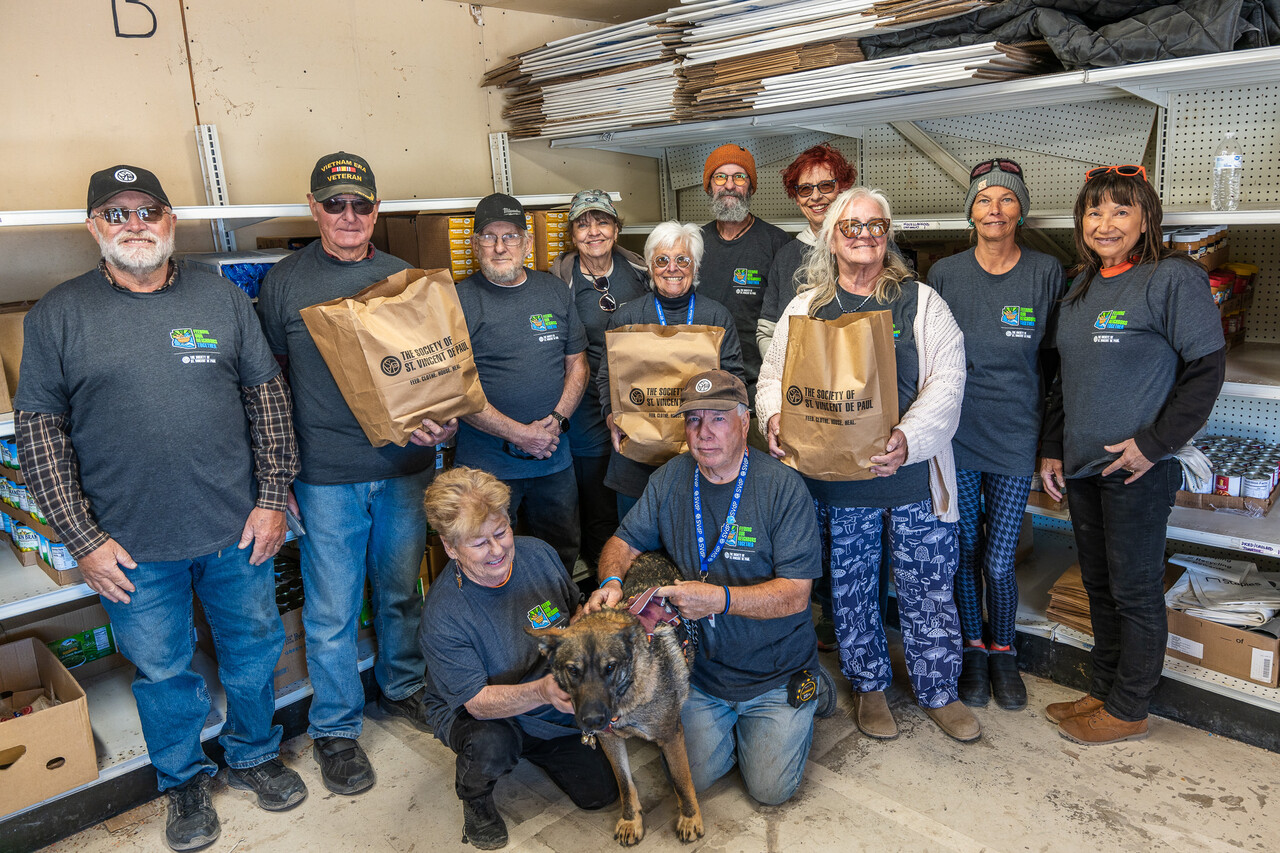 The food distribution volunteers pose for a group photo after all the guests have been helped.